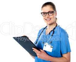 Friendly female doctor with a clipboard