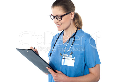 Female doctor holding a clipboard