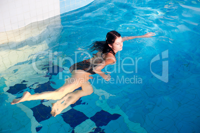 Attractive girl in swimming pool