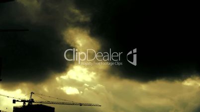 Dark clouds cover sky,Cranes,building high-rise,House silhouette.