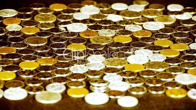caress golden coins by hand.