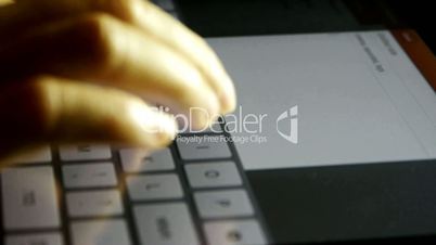 Typing an email on a touchscreen keyboard,Virtual Keyboard,Shallow depth of field.