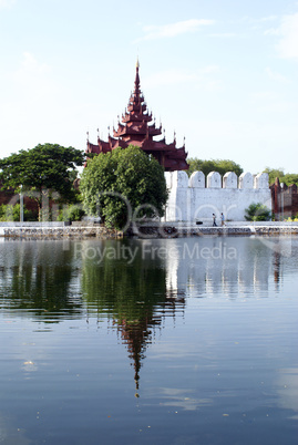 Red tower and white wall