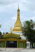 Golden stupa and green temple