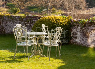 Garden table and chairs on lawn