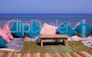 Blanket and table on beach