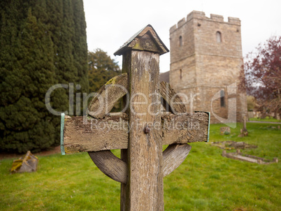 Old wooden cross in Stokesay graveyard