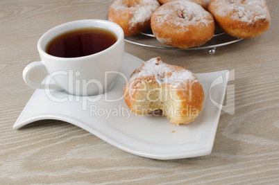 A cup of coffee and donuts
