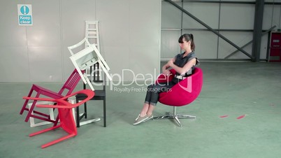 Young woman on swivel chair