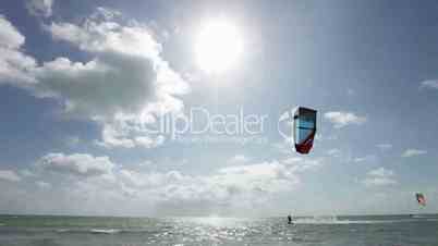 Young man kitesurfing