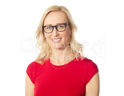 Smiling aged beautiful lady posing with eyewear