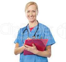 Experienced female doctor smiling at camera