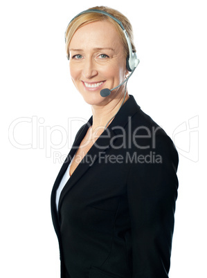 Aged female call centre excutive posing with headsets