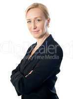 Closeup shot of a senior businesswoman posing with folded arms