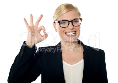 Successful business woman posing with ok sign