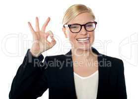 Successful business woman posing with ok sign