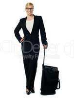 Corporate person carrying trolley bag