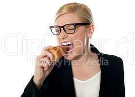 Beautiful businesswoman eating