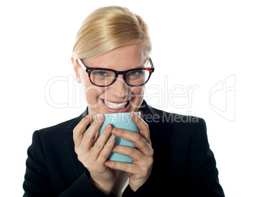 Corporate woman enjoying coffee