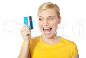 Smiling young girl holding debit-card