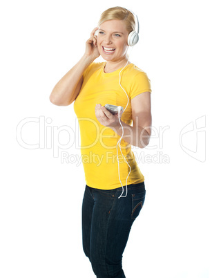 Pretty woman holding music player