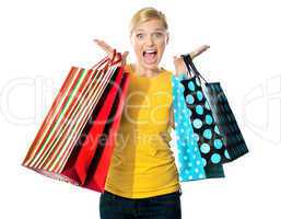 Young woman excited after tons of shopping
