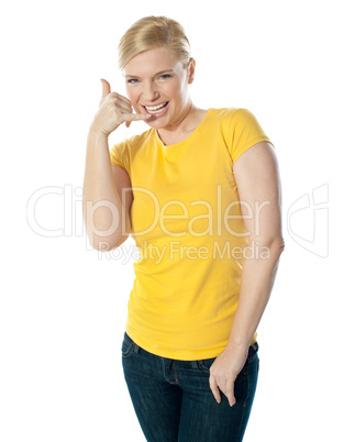 Attractive girl showing calling gesture