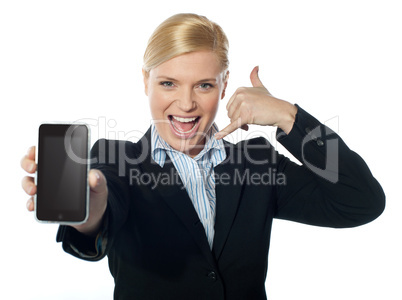 Saleswoman displaying new iphone to camera