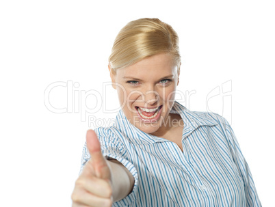 Successful businesswoman showing thumbs-up