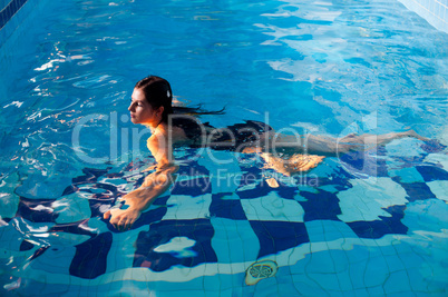 Attractive girl in swimming pool