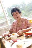 Senior woman enjoying her dining
