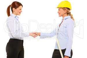 two women architect with helmet and plan
