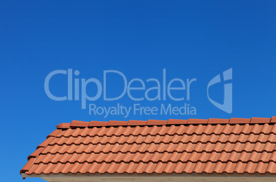 Roof tiles and blue clear sky