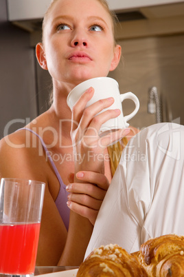 woman at home having breakfast