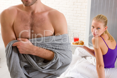 couple having breakfast in bed