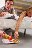 couple having breakfast in bed