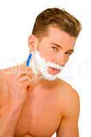 Young man shaving