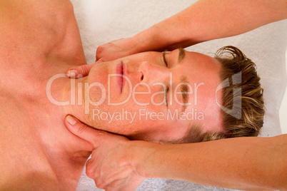 young man receives a neck massage