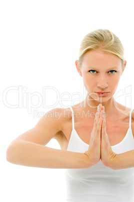 a young caucasian woman dressed in white sitting cross-legged do