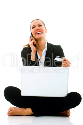 young businesswoman with laptop on the floor on white background