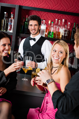 Barman prepare cocktails friends drinking at bar