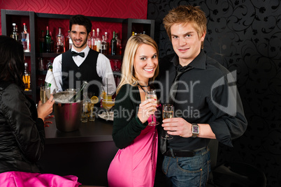 Couple at cocktail bar drink champagne