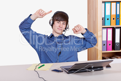 Young Businessman in office with a relaxed music