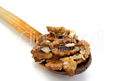 wooden spoon with walnuts