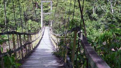 Walking the Rickety Hanging Suspension Bridge in Ecuador