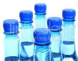 close up of gas water bottles on a white background