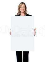 Business woman showing blank signboard