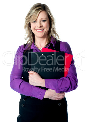 Corporate woman holding documents tightly