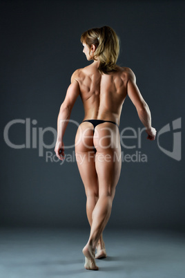 strong woman body builder show spine