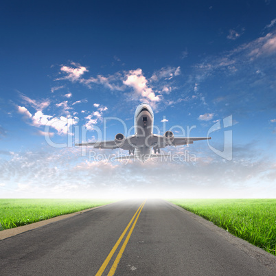 Airplane in blue cloudy sky